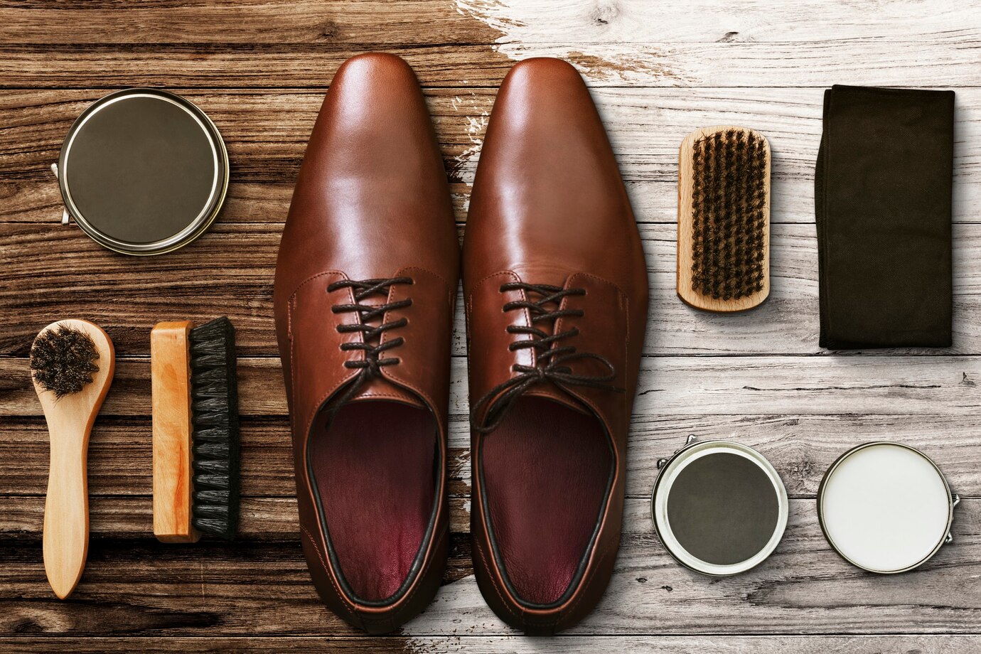 Men&rsquo;s leather shoes flat lay with polishing tools
