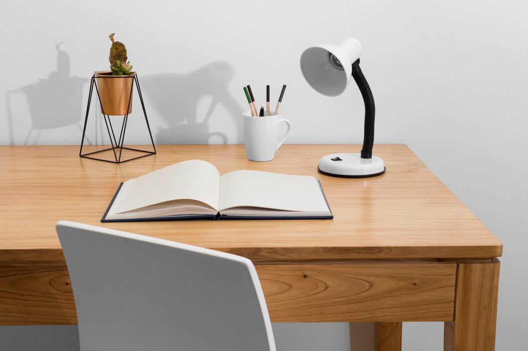 Desk arrangement with book and lamp