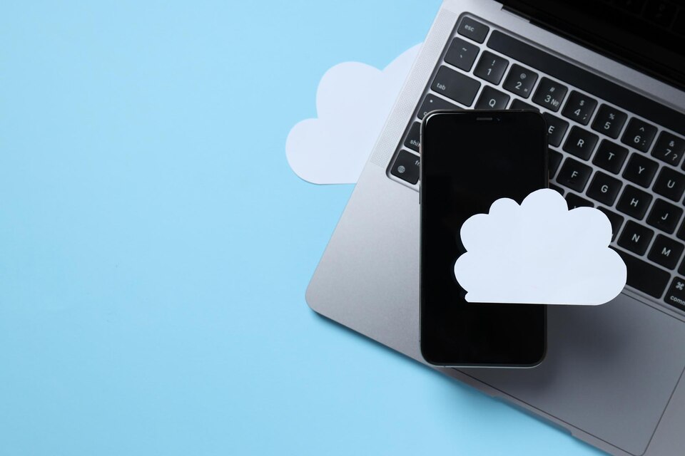 Black smartphone with a paper white cloud on a blue background