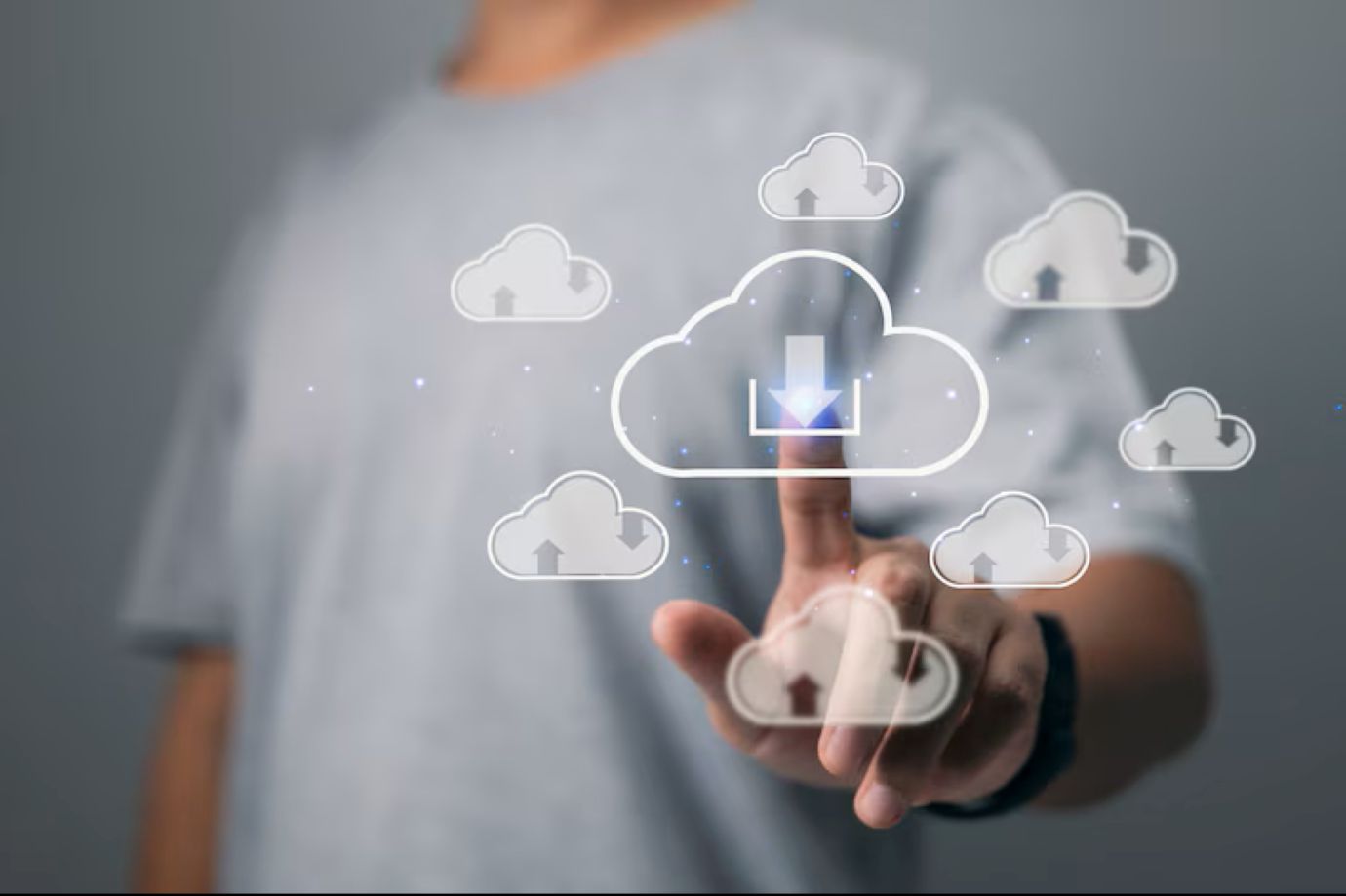 A man touches the cloud download link. Cloud computing is a technology