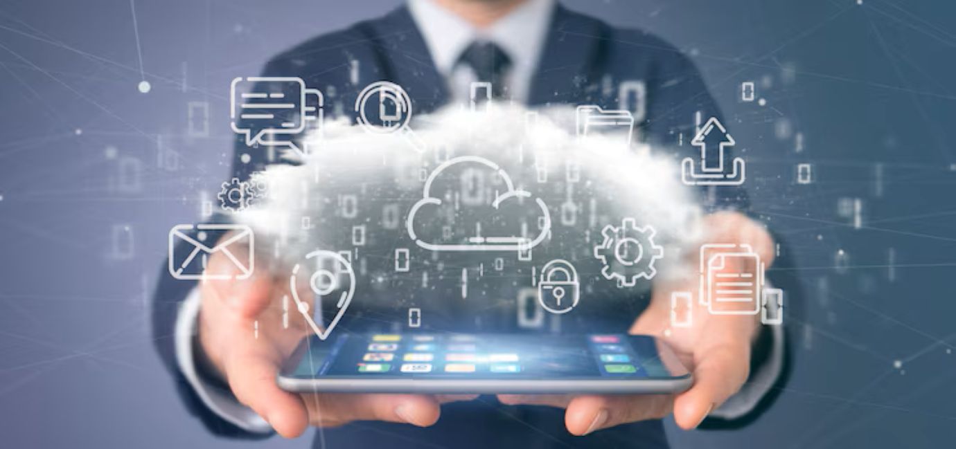 Businessman holding a cloud of multimedia icon