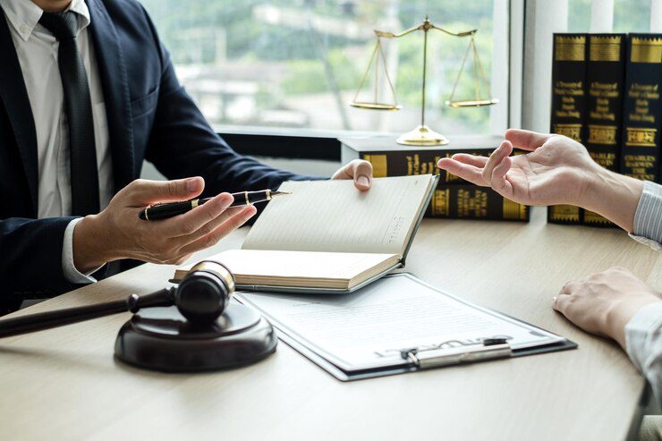 Midsection of man using mobile phone on table